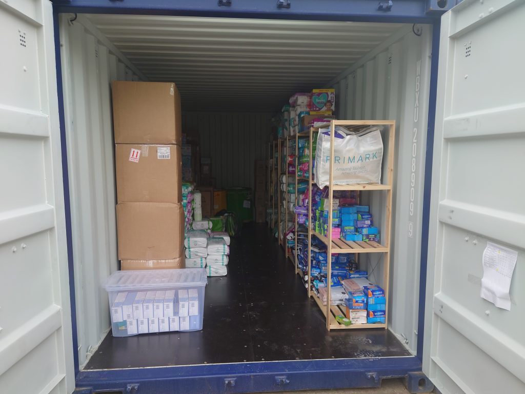 Storage container filled with organized boxes, supplies, and household items